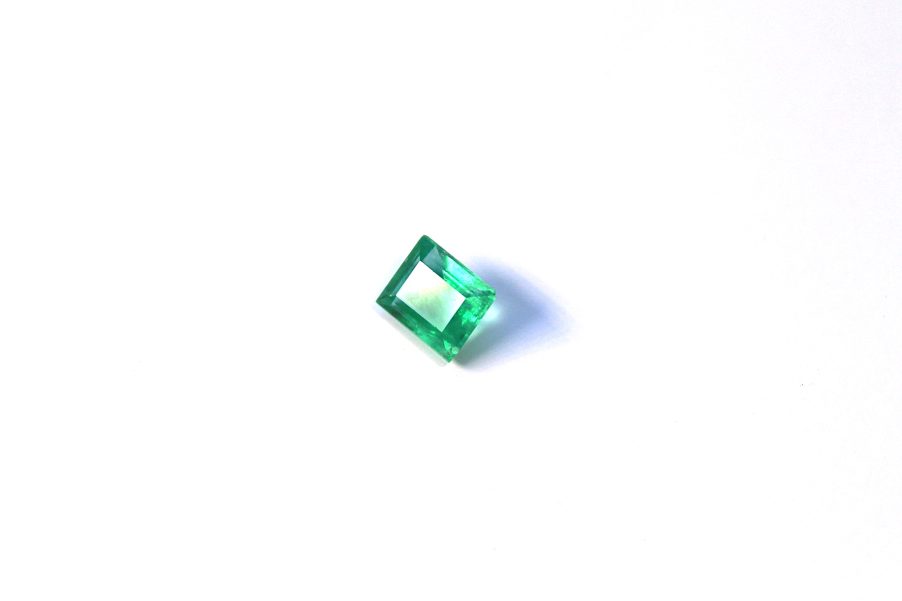 Medium light green Emerald in princess cut
