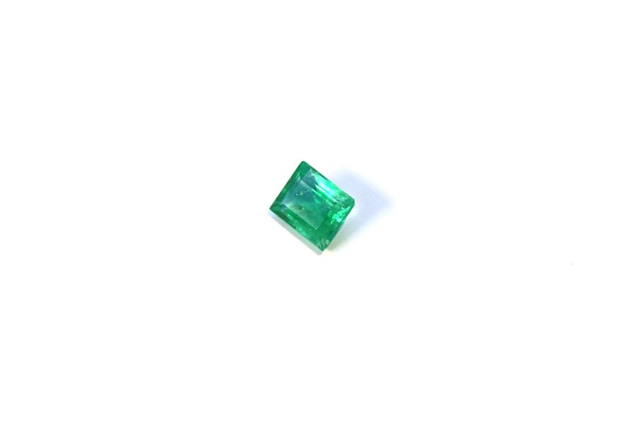 Medium light green Emerald in princess cut
