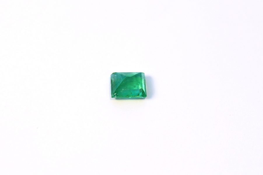 Medium light green Emerald in princess cut