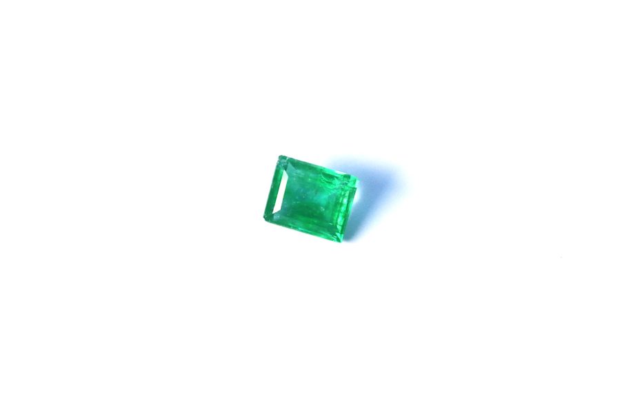 Medium light green Emerald in princess cut