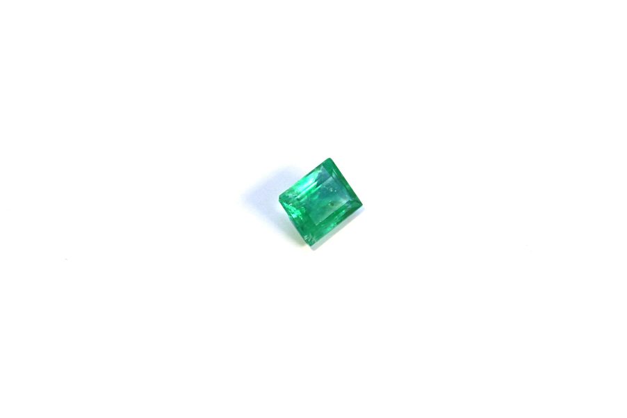 Medium light green Emerald in princess cut