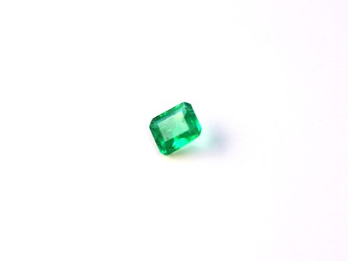 Medium light green natural Emerald in emerald cut